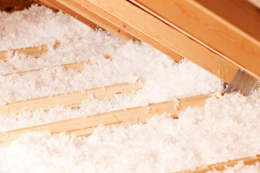 Cellulose vs Fiberglass Insulation: All You're Looking for in One Post Attic floor insulated with blown-in fiberglass insulation, attic insulation ,insulation materials, blown in insulation